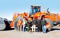 Top Lift Enterprises employee Steve Widomski delivers a new Doosan DL550-3 wheel loader to Vicdom Sand and Gravel